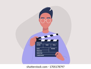 Movie production, young male character holding a clapper board, video industry