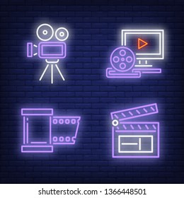 Movie projector, clapper, reel and computer neon signs set. Entertainment, cinema, movie industry design. Night bright neon sign, colorful billboard, light banner. Vector illustration in neon style.