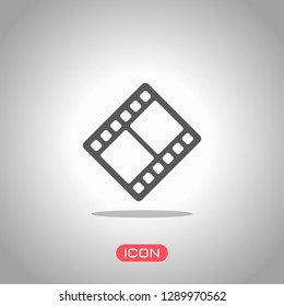 movie strip. simple silhouette. Icon under spotlight. Gray background