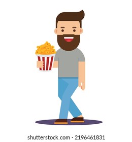 Movie time. Young man at the cinema with popcorn
