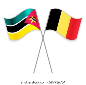 Mozambican and Belgian crossed flags. Mozambique combined with Belgium isolated on white. Language learning, international business or travel concept.