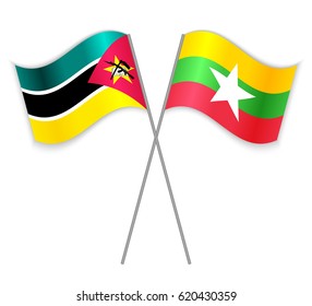 Mozambican and Burmese crossed flags. Mozambique combined with Burma isolated on white. Language learning, international business or travel concept.