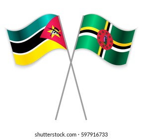 Mozambican and Dominican crossed flags. Mozambique combined with Dominica isolated on white. Language learning, international business or travel concept.