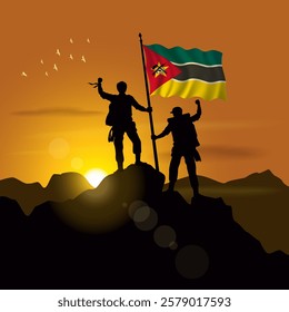 Mozambique flag, silhouette of two climbers holding flags at sunset