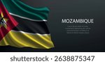 Mozambique national flag with ripples and shadows on a gradient black backdrop