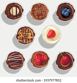 Muffins, cupcakes and fabulous cakes of different types against a gray background and shadows from them