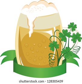 Mug of beer decorated with a clover