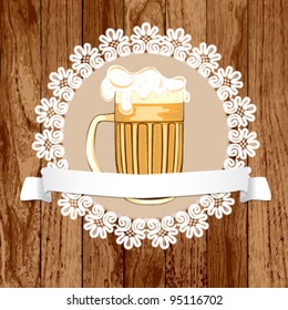 Mug of beer on a wood background