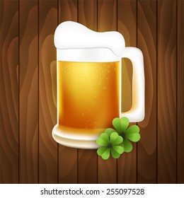 Mug of beer on a wooden background
