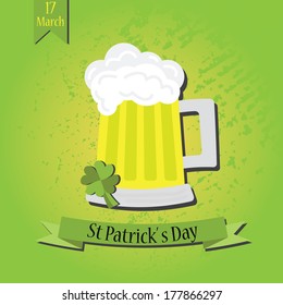 Mug of beer with St Patrick's Day ribbon banner-including four leaves shamrock on textured background and hanging date ribbon