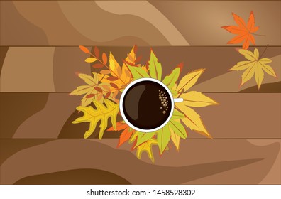 A mug of hot coffee and autumn leaves on a wooden background.