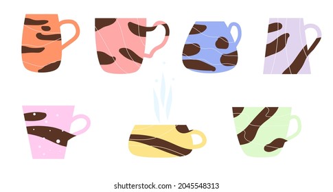 Mugs, cups of different shapes and colors with tiger stripes.