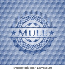 Mule blue badge with geometric pattern background.