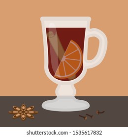 Mulled wine with spices on table