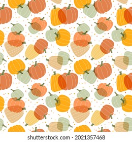 Multi colored pumpkins on a white background. Seamless vector pattern in flat style. 