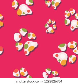 Multicolor dog paw print seamless pattern. Colorful vector design, great for all dog and puppy products and businesses. Some usage ideas are graphic design projects, textiles,  stationery and parties.