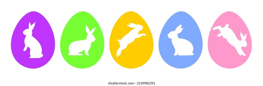 Multicolor Easter eggs with white rabbits on them isolated on a white background