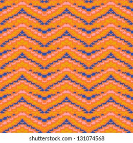 multicolor geometric hipster pattern with zig-zag shapes in bold orange, red and blue colors, stylization of Mexican native art Texture for textile, print, wallpaper in spring - summer or fall fashion