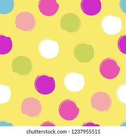 Multicolor inkbrush dots on yellow background repeating pattent use for textile,surface,decorations,prints,packaging,holiday theme