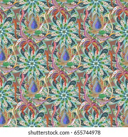 Multicolor ornament of small simple flowers, vector abstract seamless pattern for fabric or textile design.