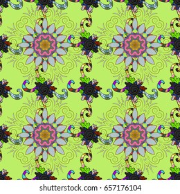 Multicolor ornament of small simple flowers, vector abstract seamless pattern for fabric or textile design.