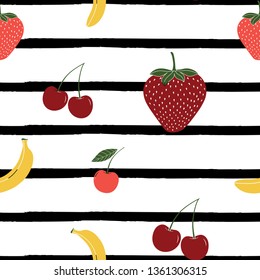 Multicolor seamless vector pattern with green, pink and yellow strawberries, bananas and cherries on striped background. Surface pattern design.Summer fruits.