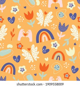 multicolored abstract elements for baby design, rainbow and flowers in doodle style on orange background, vector seamless pattern