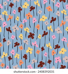 Flores multicolores, abstractas, con tallos que repiten sin fisuras. Vector, botánico por toda la superficie sobre la impresión sobre fondo azul.