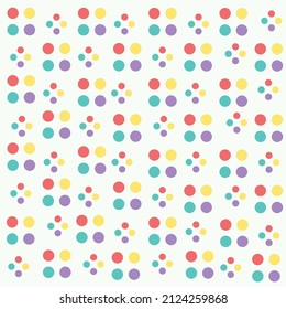 multicolored abstract polka dots on white background seamless pattern