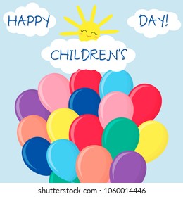 Multicolored balloons against the sky. Clouds and sun. Happy children's day.