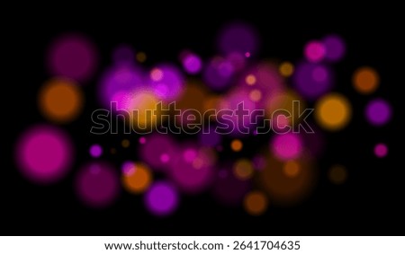 Multicolored blurred bokeh particles with violet, blue, pink hues floating on black background, creating festive or dreamy abstract composition.