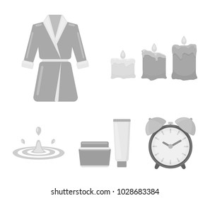 Multicolored burning candles, a pink robe with a yellow belt and a collar, a tube with cream and a jar with an ointment, a drop of water.Spa set collection icons in monochrome style vector symbol