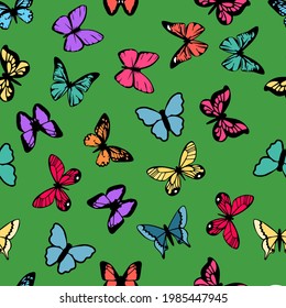 Multicolored butterflies on a green background