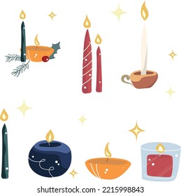 Multi-colored Christmas candles with a sprig of spruce decor