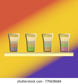 Multicolored cocktail in small glasses
