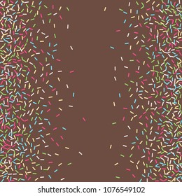 Multicolored confetti on a brown background. Sprinkle for cakes and muffins.