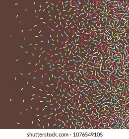 Multicolored confetti on a brown background. Sprinkle for cakes and muffins.