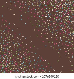 Multicolored confetti on a brown background. Sprinkle for cakes and muffins.