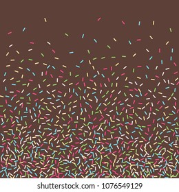 Multicolored confetti on a brown background. Sprinkle for cakes and muffins.