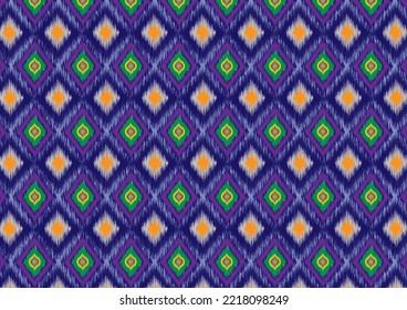 Multi-colored diamond-shaped triangles with ikat fabrics laid on top of each other, arranged sideways, looking elegant and elegant on a blue background.