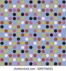 Multi-colored dots on a blue canvas. An abstraction from ordinary dots, and all this with grain on top.