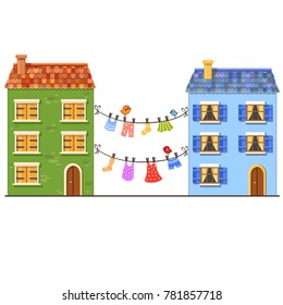 Multicolored drying clothes hanging on a washing rope between two houses with color little birds. Summer vector illustration. Socks, trousers, skirt and a dress on a rope with pins. European street
