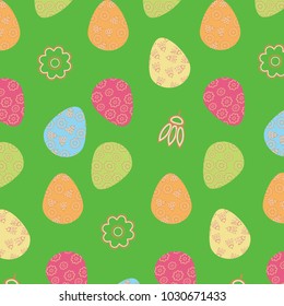 Multicolored easter eggs decorated with flowers, and decorative flowers on a green background - easter seamless pattern.