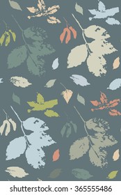 Multicolored floral seamless pattern with leaves of wild grape, ash tree and seeds of maple stylized as stamp or imprint, against dark background. May be used for textile or in scrapbooking