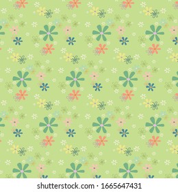 Multicolored flowers. Pattern with a green background.