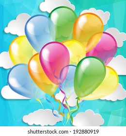Multicolored glossy balloons on a sky background