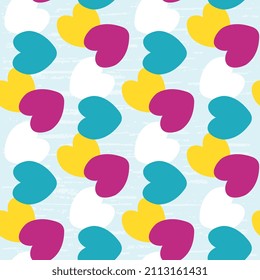 Multicolored hearts are jumbled on a bluish textured background. Vector seamless illustration for Valentine's day.