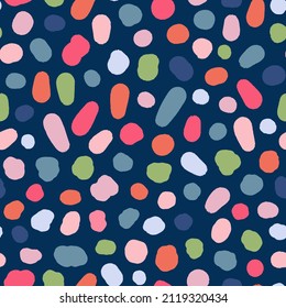 Multicolored, irregular polka dots seamless repeat pattern. Random placed, vector stains all over surface print on blue background.