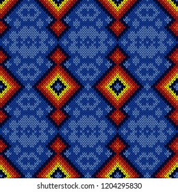 Multicolored knitted ornamental seamless pattern in blue, red, yellow and orange colors, vector as a fabric texture