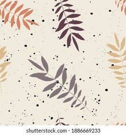 Multicolored leaves with splashes on a sandy background. Seamless pattern, pastel colors.